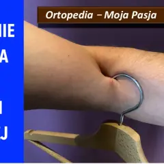 Zerwanie bicepsa w części dalszej. Ramię z wieszakiem, symbolizujące uraz. Ortopedia – Moja Pasja #028.