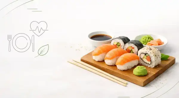 Zestaw sushi na desce, sos sojowy, wasabi. Czy sushi jest kaloryczne? Zależy od składników, ale często jest to zdrowa opcja.